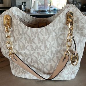 Michael Kors logo bag with gold chain/tan straps! Very good condition!